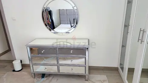 Elegant Mirrored Dresser with Round Mirror