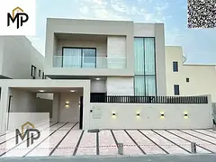 A luxurious villa for sale in Al Zahia area, one of the most prestigious areas of Ajman, with an ele