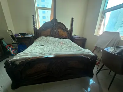 Beautiful Ornate Wooden Bed with Luxurious Upholstery
