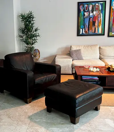NATUZZI Leather Armchair with Matching Ottoman