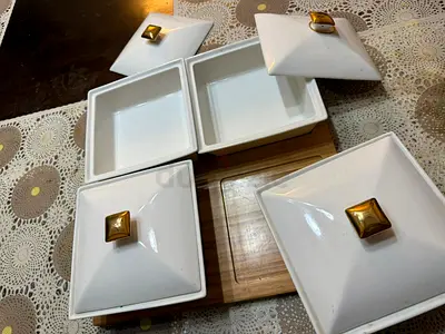 Elegant White Ceramic Storage Bowls with Golden Accents