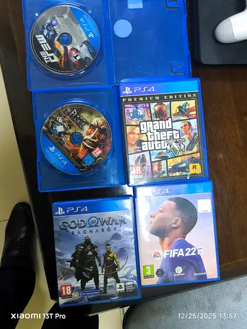 PlayStation 4 Game Collection: GTA V, FIFA 22, $% of War, and Metro Exodus