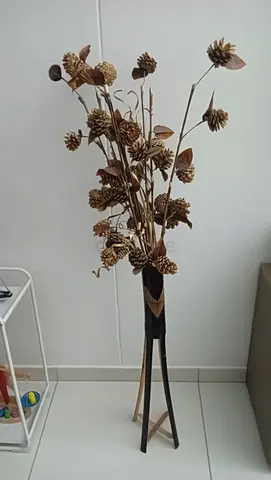 Wooden vase with copper golden flower
