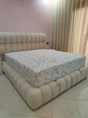 Elegant Cream Bed with Stylish Headboard