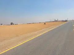 Commercial land for sale in Rawdat Al Qurt, Al Ruwaidat suburb, Sharjah