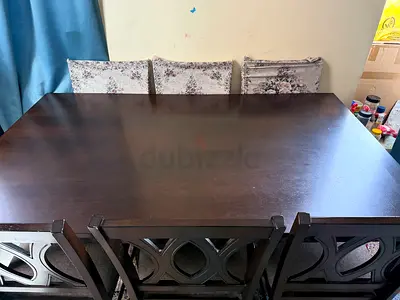 Sturdy Wooden Dining Table with Elegant Chairs