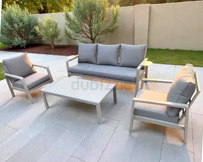 High-quality beige aluminium outdoor garden sofa set complete with a matching table
