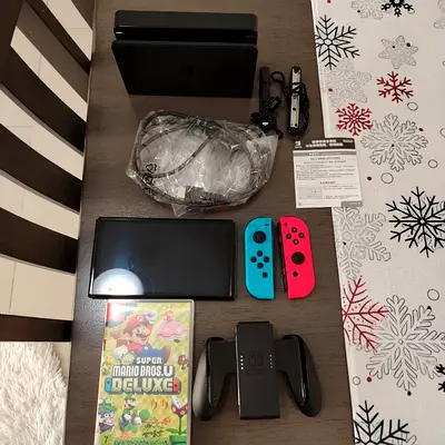 Nintendo Switch with Accessories and super mario bros. u deluxe game