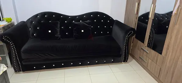 Elegant Black Velvet Sofa with Decorative Studs