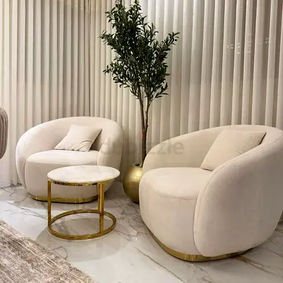 *“Luxurious Cream Velvet Swivel Accent Chairs with Gold Base Finish”*