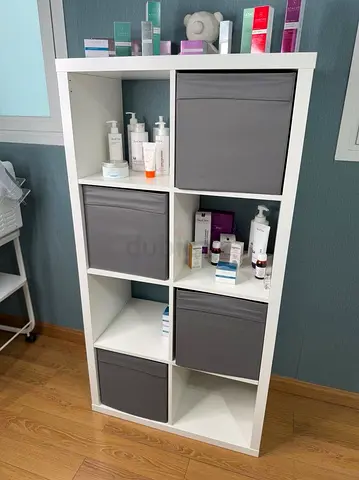 Stylish White Storage Unit with Gray Bins