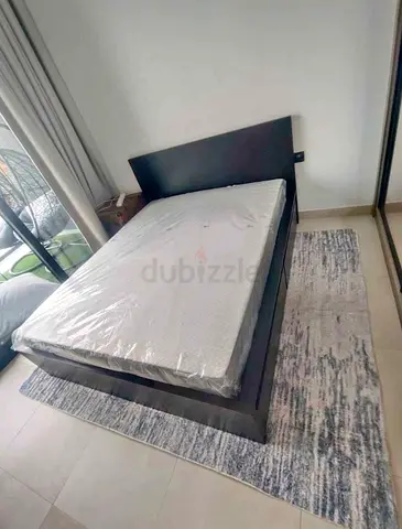 IKEA queen‑size bed (160 × 200 cm) with 2 storage drawers underneath and an IKEA mattress