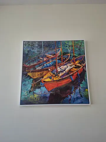 Framed Artwork of Colorful Boats on Water