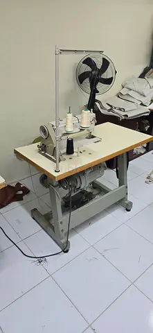 Juki industrial straight stitch sewing machine. DDL-5550N model with table