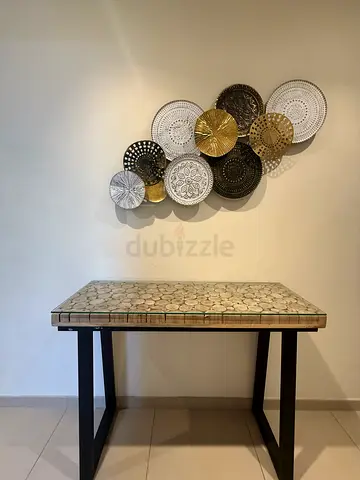 Console with wood and art piece that comes with it