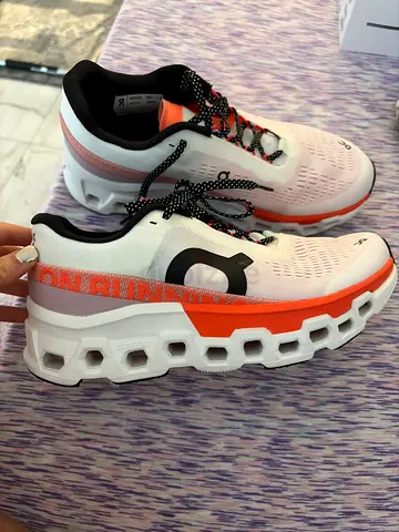 On cloudmonster 2 orange and white