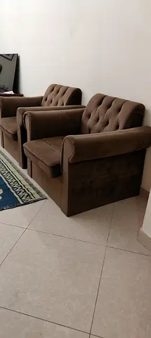 Comfortable Brown Upholstered 2 one-seater sofas