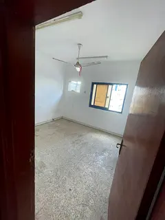 For annual rent in Sharjah, area of Umm Al Tarfa: two rooms, a living room, a bathroom, and a balcon