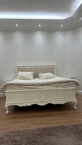 Elegant White Bed with Storage