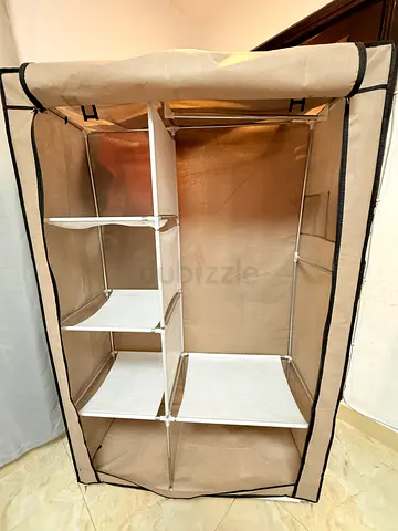 Portable clothes storage cabinet