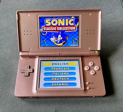 Nintendo DS Lite, Metallic Rose color with SONIC Classic Collection game.