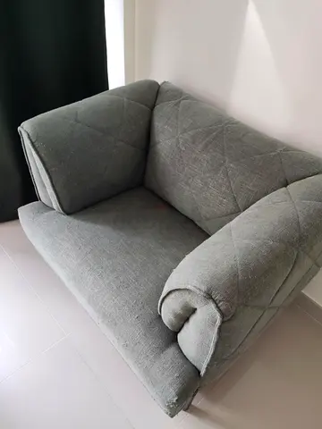 Green/grey fabric armchair