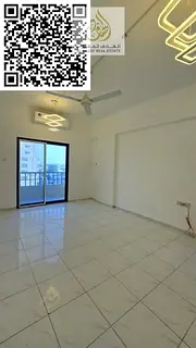 A separate room and living room, a large hallway with a balcony, and two bathrooms in Al Nuaimiya 1,
