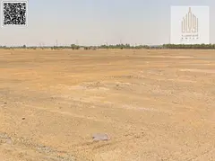 Residential land for sale in Manama 11, corner plot on 4 streets | on a main street