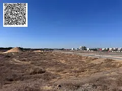 Land for sale in Ajman, Al Alia area, residential/commercial. Building permit: Ground + 5 floors. La
