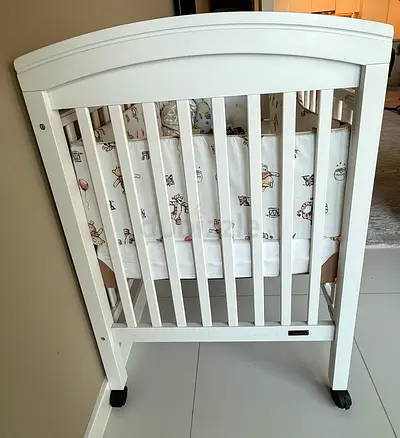 White Wooden Crib with Wheels