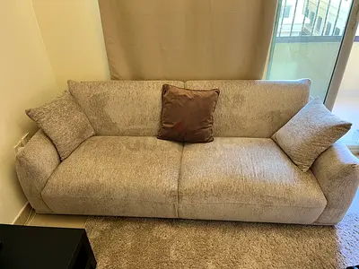 3 Comfortable beige Sofa with Cushions