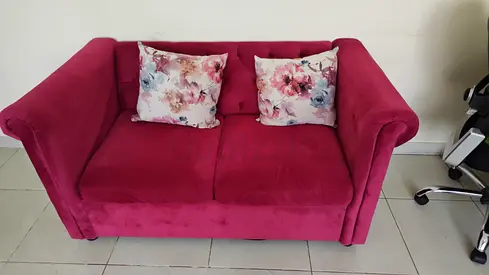 Chic Pink Velvet Loveseat with Floral Cushions