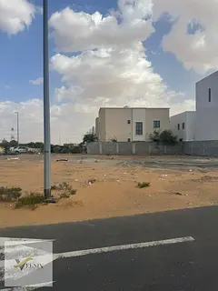 NO COMMISSIONS Freehold townhouse plots , including registration fees, in a prime location in Al Hel