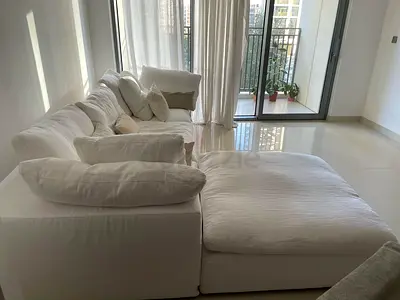 Cloud feather filled The Lőőm Collection Sofa with footstool