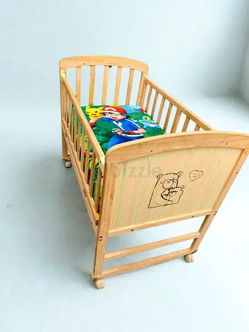 Beautiful 4 wheel Wooden Crib cum rocker with Soft Bedding Mattress