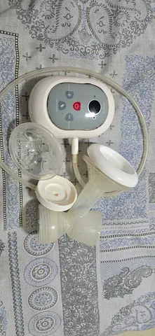 Juniors electric breast milk pump along with pump insert and valves