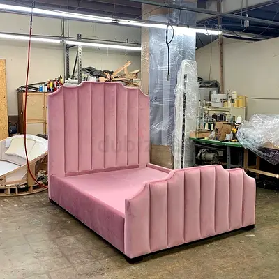 Elegant Pink Velvet Bed with Distinctive Headboard