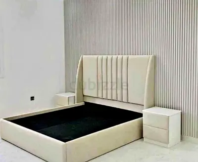 Elegant cream-colored bed with storage in excellent condition