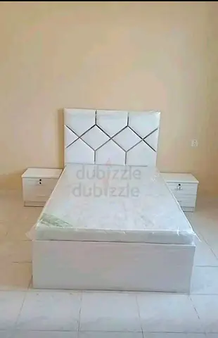 Elegant White Bed with Nightstands