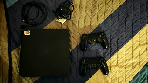 Sony PlayStation 4 Console with Two Controllers