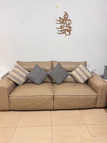 Comfortable Beige Leather Sofa with Cushions