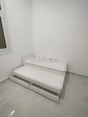 Ikea slakt bed frame with under bed and 2 storage drawers underneath with 2 Ikea mattresses