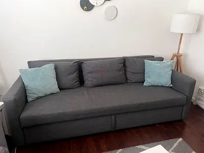 Comfortable Grey Sofa bed with Accent Pillows