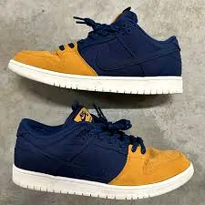 This is a Nike SB Dunk Low Pro PRM in the Midnight Navy and Desert Ochre colorway.