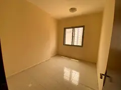 Golden opportunity for annual rent in Ajman: Two bedrooms, a living room, a balcony, and parking ins