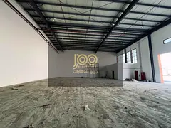 A spacious warehouse is available for rent in the Umm Al Thu'ub area, boasting a prime location 