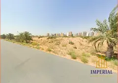 Residential/commercial land in Al-Aliya, corner plot on two streets (G+23), freehold ownership for a