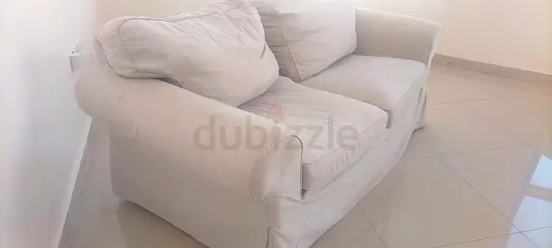 two seater sofa available In najda street abu dhabi