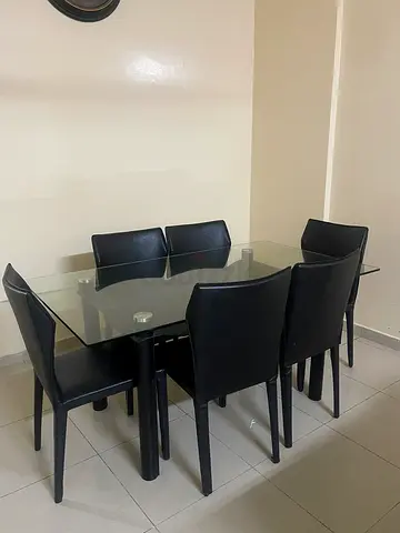 Modern Glass Dining Table with Black Chairs