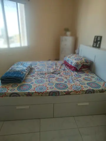 Comfortable Bed with Storage and Colorful Bedding